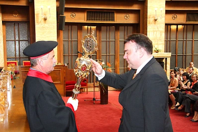 Prof. Dr. Mathias Kunze reciting the traditional doctoral oath during the PhD ceremony at Comenius University in 2009. Prof. Dr. Mathias Kunze taking the doctoral oath at the conferment in 2009.